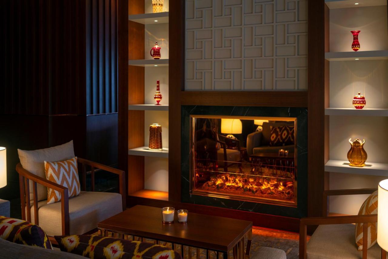 Moevenpick Hotel Istanbul Asia Airport Exterior foto The fireplace at the lobby